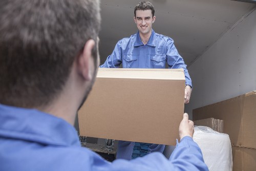 Professional movers handling furniture in a flat move