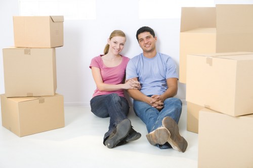 Professional movers handling furniture with care in Lisson Grove