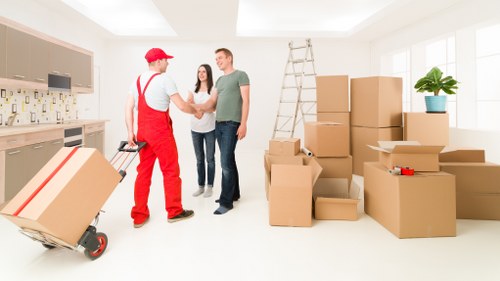 Professional man with a van service in Lissongrove handling belongings carefully