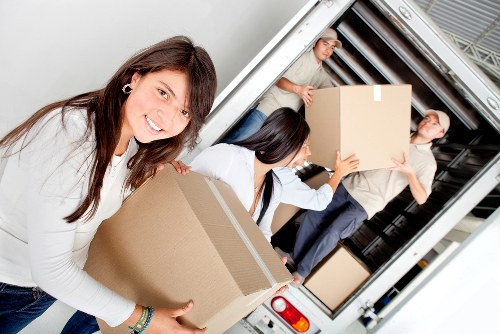 Packed boxes and furniture loaded into a hire removal truck