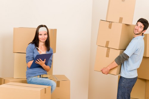 Professional movers loading household items for a Lisson Grove relocation